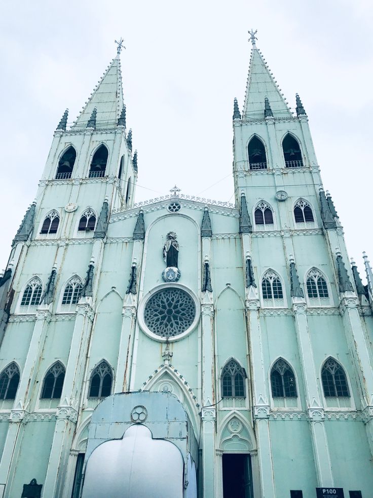 an old church with tall towers and windows