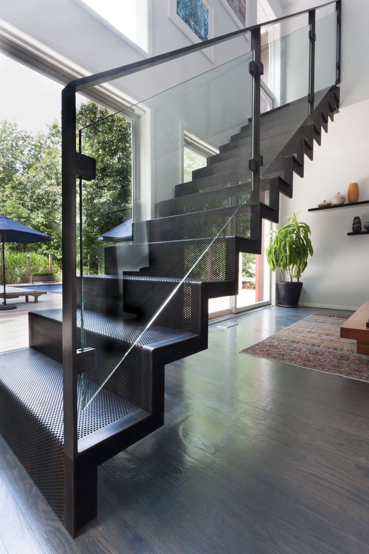 a stair case in the middle of a living room