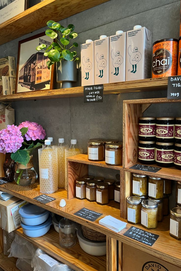 the shelves are filled with different types of food and drink items, including teas