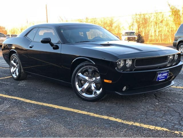 a black sports car parked in a parking lot