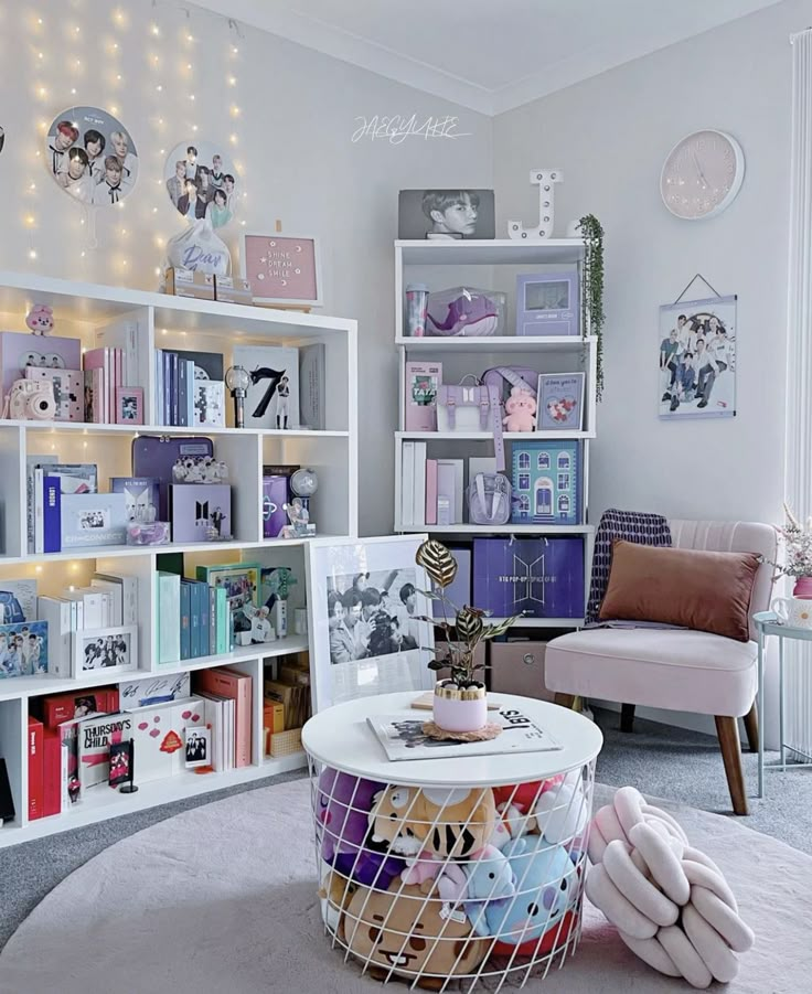 a living room filled with lots of furniture and bookshelves on top of shelves