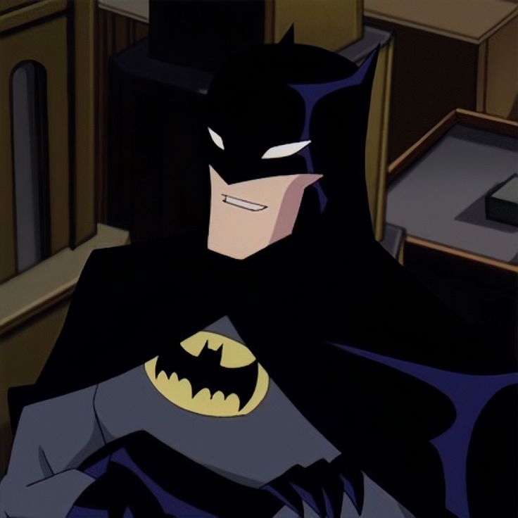 the batman animated character is sitting down