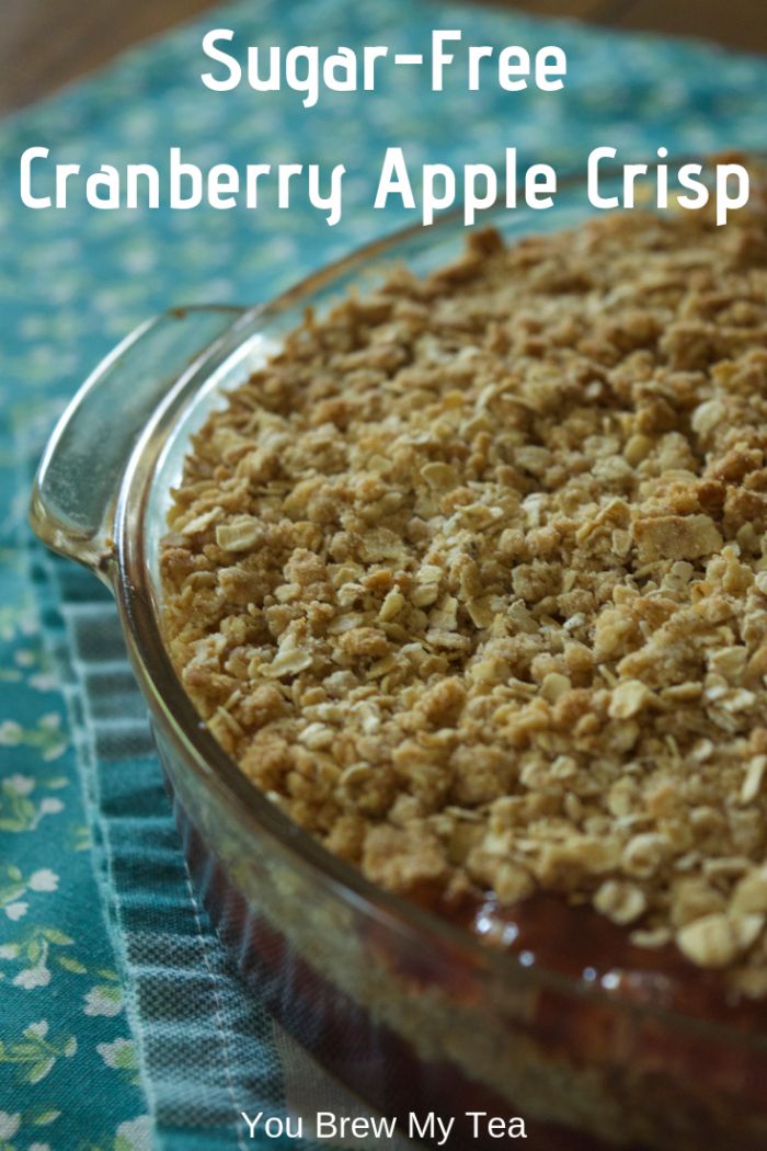 a close up of a pie in a pan on a table with the words sugar - free cranberry apple crisp