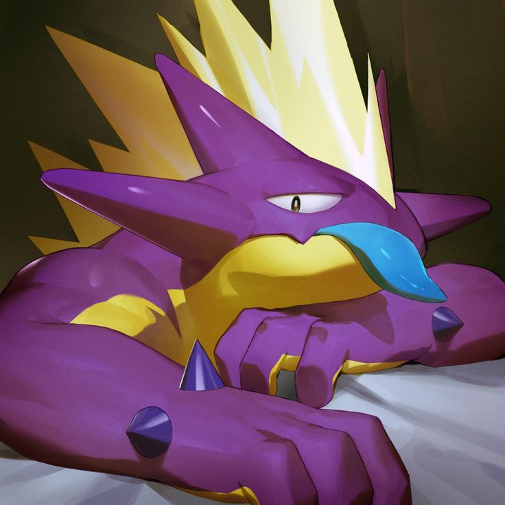 a purple and yellow dragon laying on top of a bed