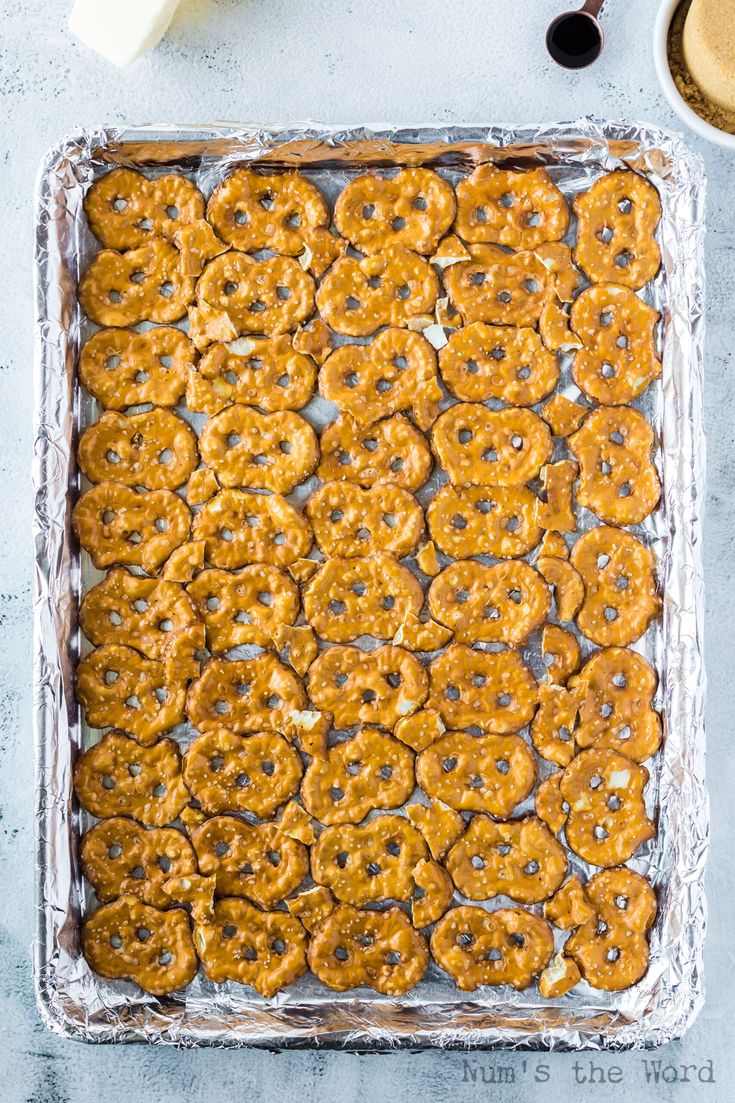 a pan filled with cookies on top of a table