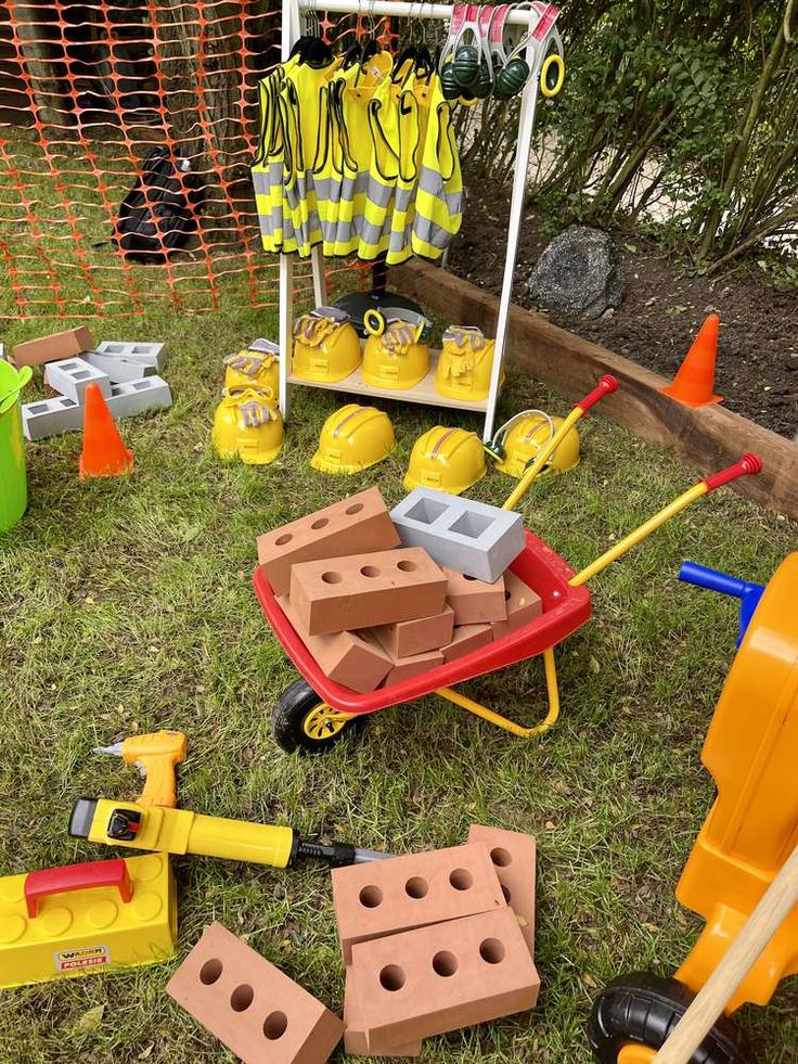 toys and construction equipment sitting on the grass