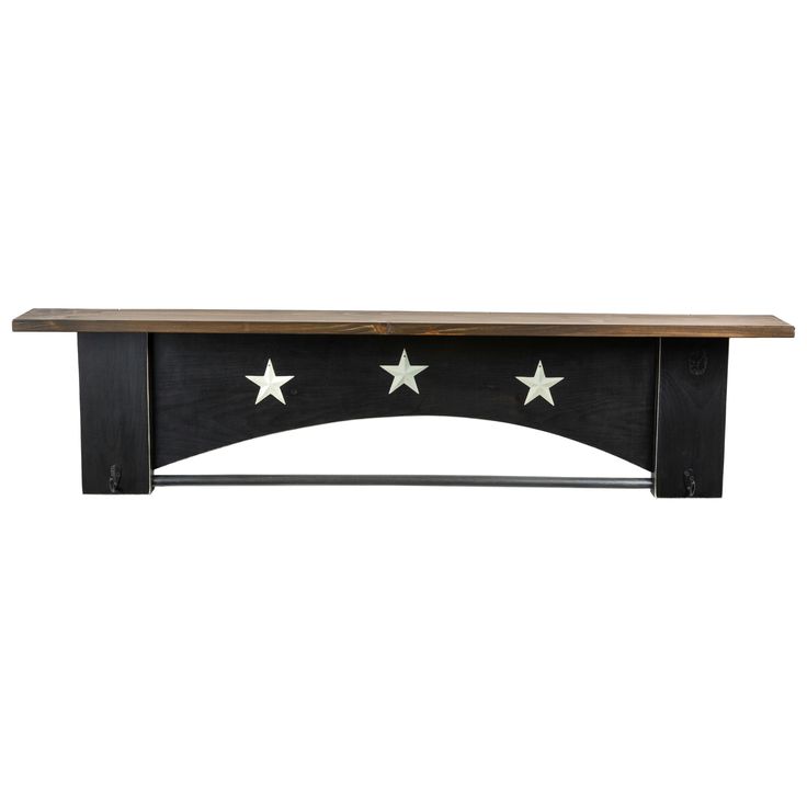 a wooden table with stars on it and a shelf above the top that is black