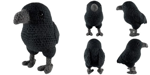 four black crocheted birds are shown in different positions and sizes, including one with its head turned to the side