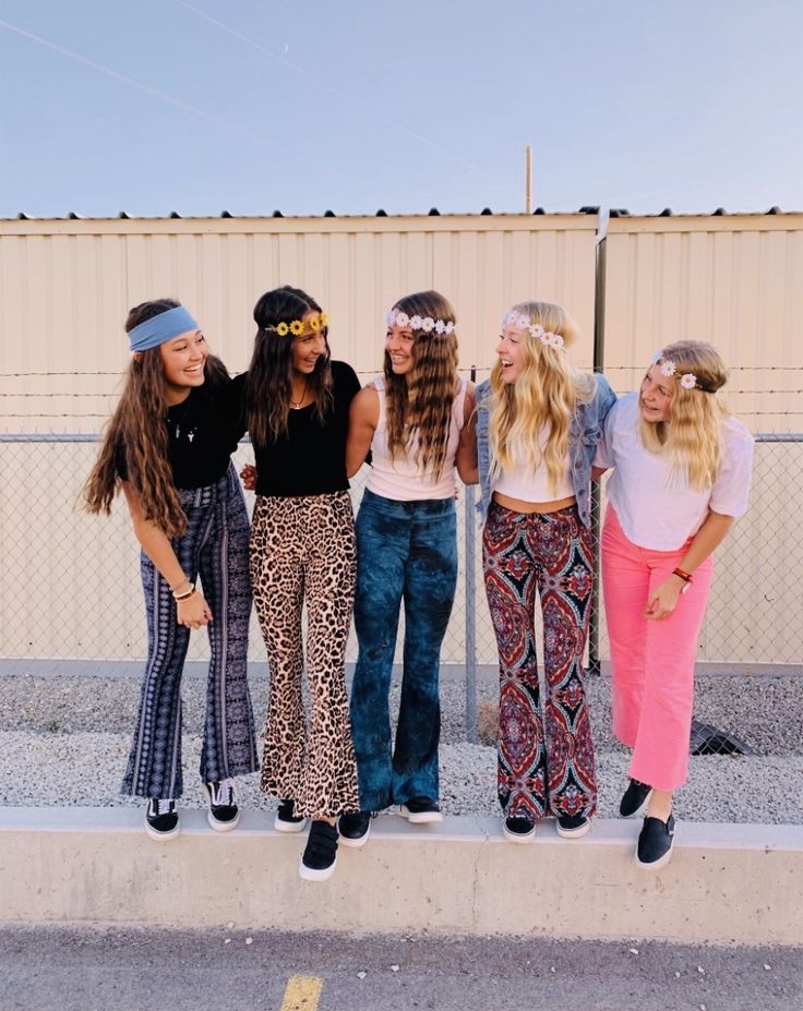 four young women standing next to each other