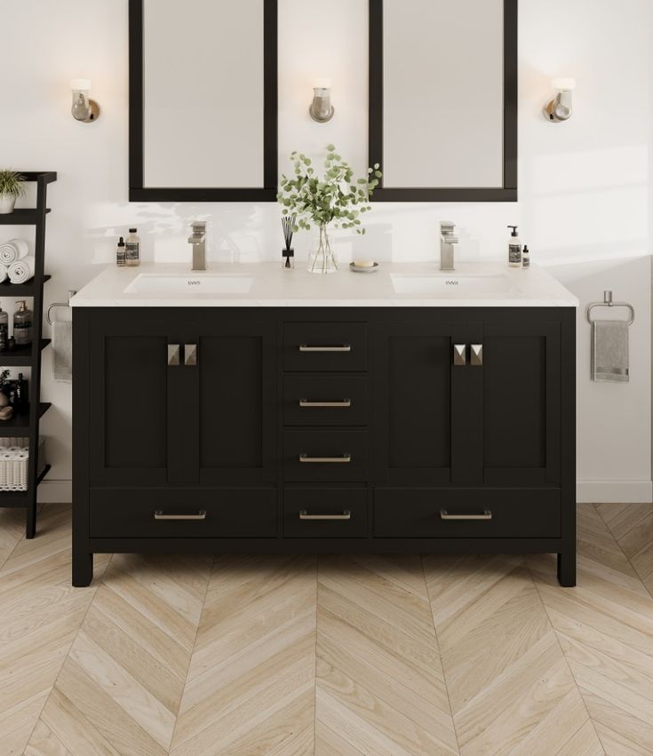 a bathroom vanity with two mirrors above it