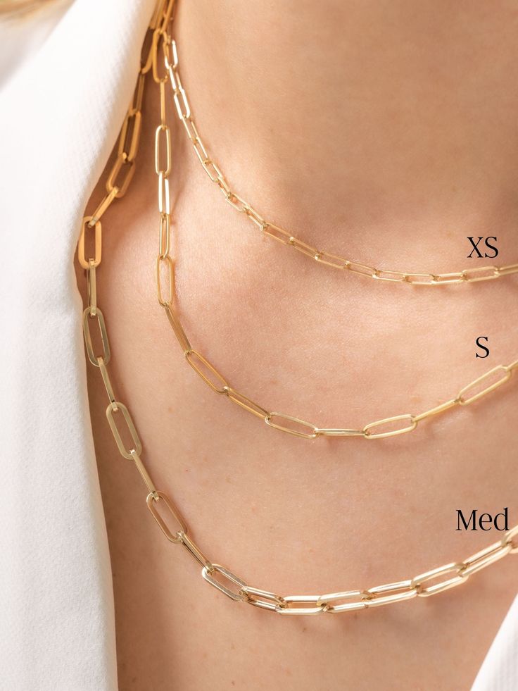 This 14K classic gold chain is a modern basic for every woman with its rectangular 'paperclip' links. We are in love with this delicate chain that can be worn on its own, layered with other necklaces or holding your favorite charms and pendants. The clasp can hook on any of the chain links so you can wear this necklace at any shorter length making it super versatile! Paper Clip Necklace, Necklace Stack, Paperclip Chain Necklace, Chain Links, Delicate Chain, Initial Jewelry, Yellow Gold Chain, Classic Gold, Day And Night