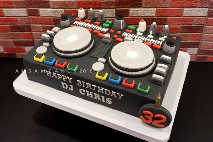 a birthday cake that is shaped like a dj's turntable