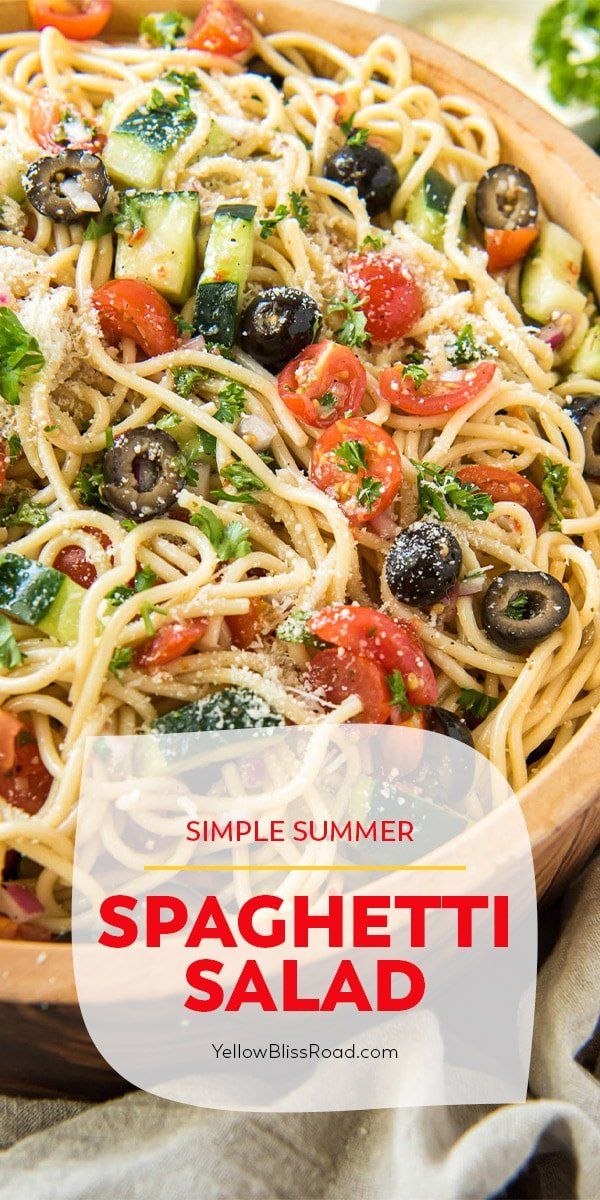 an image of spaghetti salad with olives and tomatoes