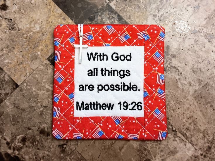 a red and white tile with a bible verse on it that says, with god all things are possible