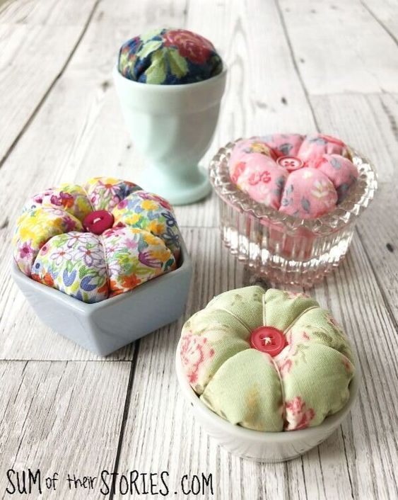 three small bowls filled with donuts on top of a wooden table next to each other