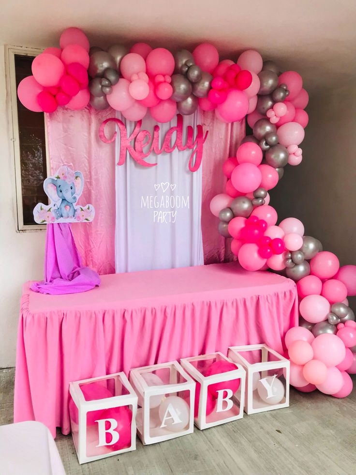 a baby shower party with balloons and decorations