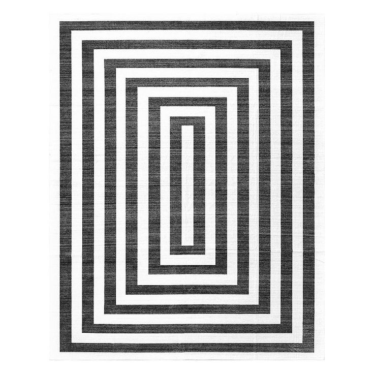 a black and white rug with an interlocked square pattern on the bottom half