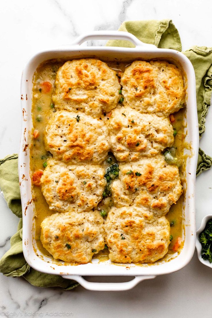 chicken pot pie casserole in a white baking dish on a marble countertop