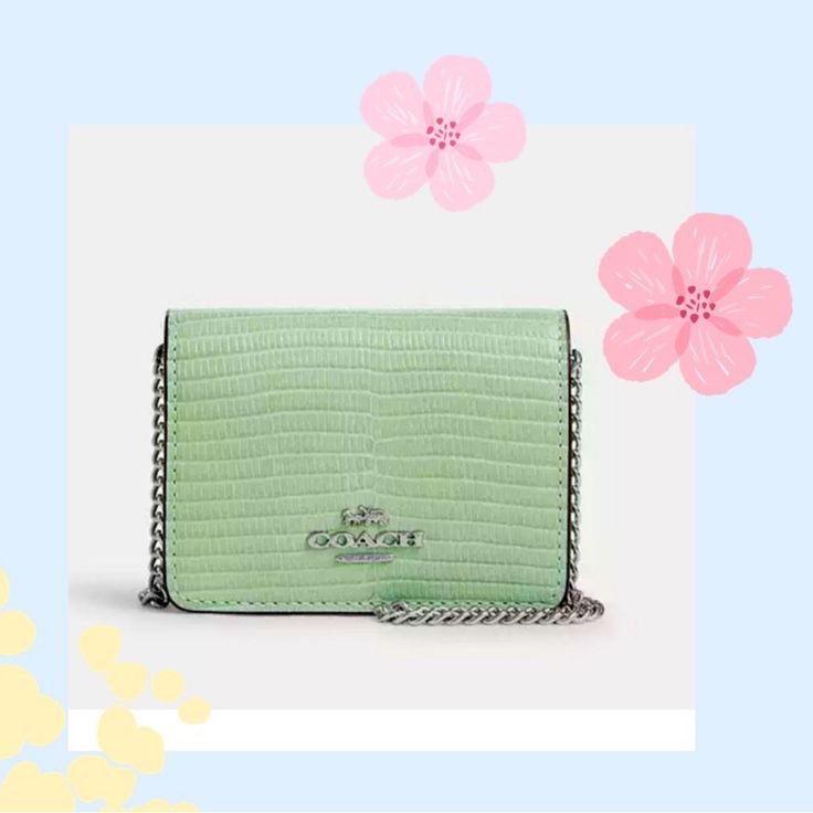 Nwt Coach Mini Wallet On A Chain Color: Silver / Pale Green Measurements Length: 4.0" Height: 3.0" Width: 1.0" Materials Lizard-Embossed Leather Fabric Lining Strap Detachable Chain Strap With 23.25" Drop For Shoulder Or Crossbody Wear Features Outside Open Pocket Two Credit Card Slots Snap Closure Silver Rectangular Wallet On Chain With Strap, Chic Coach Rectangular Wallet On Chain, Rectangular Wallet On Chain With Silver-tone Hardware, Coach Rectangular Wallet On Chain With Strap, Silver Wallet On Chain For Everyday Use, Coach Wallet On Chain With Details, Chic Wallet With Chain Strap For Gift, Chic Wallets With Chain Strap For Gift, Chic Wallet With Chain Strap As Gift