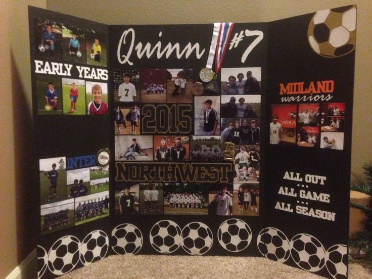 a soccer themed quilt is displayed in front of a wall with pictures and words on it