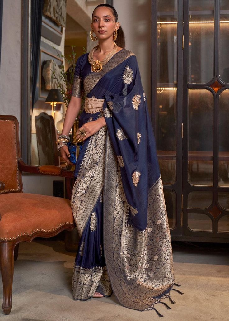 A khadi Georgette Banarasi saree is an exquisite blend of tradition and elegance, crafted in the ancient city of Varanasi. Made from lightweight, sheer georgette fabric, this saree is adorned with intricate brocade or zari work, featuring timeless motifs like florals, paisleys, and Mughal-inspired designs. --------------------------------- S A R E E ● D E T A I L S --------------------------------- ● Fall and Edging : Done ● Tassel : See in Option ● Petticoat : On request Extra Charges ● Drapping Saree (Ready to wear) : On Request Extra Charges ● Blouse : Matching Unstitched Piece (See in option) ● Occasion : Wedding, Party, Festive, Function ● Type: Bollywood ● Includes : 1 Saree, 1 Blouse Piece ● Saree length : 5.5 meter ● Blouse piece : 0.8 meter ● Wash Instruction:- Dry Clean Only Prem Drapping Saree, Indigo Saree, Navy Blue Party, Simple Sarees, Saree Design, Ethnic Looks, Blue Saree, Elegant Saree, Wear Saree