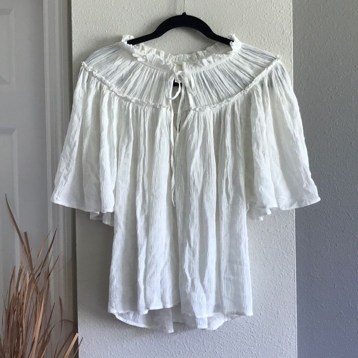 H&M Top Nwt Xsmall White Ruffle Tie Neck Flutter Sleeves Flowy Beautiful Soft Flounce Loose Fit Style Can Fit Size Small And Medium Sold Out Online Smoke-Free, Pet-Free Home Final Sale, No Returns Chic Vacation Peasant Top With Short Sleeves, Chic Short Sleeve Peasant Top For Vacation, Spring Casual Peasant Top With Flutter Sleeve, Flowy Summer Peasant Top For Brunch, Flowy Short Sleeve Peasant Top For Vacation, H&m Blouse For Spring Vacation, Casual Peasant Top With Flutter Sleeves For Summer, Casual White Blouse With Butterfly Sleeves, White Short Sleeve Peasant Top For Brunch