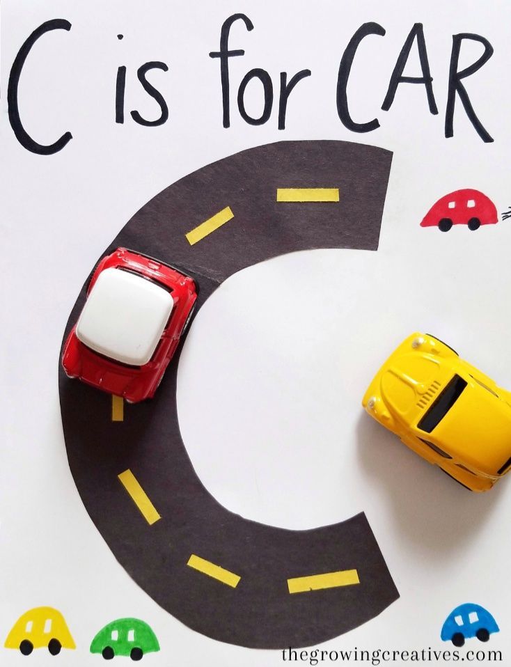 a close up of a paper plate with cars on it and the letter c is for car