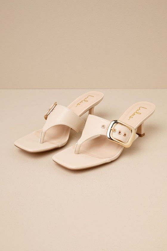 The Lulus Meline Bone Buckle Thong Slide Sandals are the fastest way to make any 'fit even more chic! Smooth faux leather shapes these must-have sandals that feature a trendy square footbed, a classic thong upper, and a wide vamp strap with an adjustable gold buckle detail at the side. An eye-catching sculpted heel completes the sleek slide-on design! 2. 5" sculpted heel. Lightly cushioned insole. Rubber sole has nonskid markings. Man made materials. Imported. Lulus | Meline Bone Buckle Thong Sl Chic Summer T-strap Sandals With Heel Loop, Chic Beige Toe Post Sandals, Chic T-strap Sandals With Toe Post For Summer, Chic T-strap Sandals With Buckle Closure, Chic Summer T-strap Sandals With Toe Post, Chic T-strap Sandals With Toe Post And Buckle Closure, Summer T-strap Sandals With Padded Heel, Chic Sandals With Buckle Closure And Toe Post, Chic Adjustable T-strap Sandals With Buckle Closure