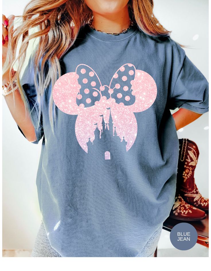 This Minnie-shaped tee is a delightful blend of charm and whimsy, featuring a vibrant pink bow adorned with daisies. Step into the world of Daisy Dreams with this adorable shirt, perfect for adding a touch of Disney magic to your wardrobe. Made from soft, comfortable cotton, it's an ideal choice for both casual outings and Disney-themed adventures. Flaunt your love for Minnie Mouse and daisies with this eye-catching tee from Oopsie Daisy! Disney Minnie Mouse Pink T-shirt, Pink Disney Cotton T-shirt, Cute Pink Minnie Mouse T-shirt, Disney Pink Minnie Mouse T-shirt, Summer Minnie Mouse Short Sleeve T-shirt, Fun Pink Minnie Mouse Top, Pink Cotton Minnie Mouse Tops, Pink Minnie Mouse Crew Neck T-shirt, Casual Pink Minnie Mouse Top