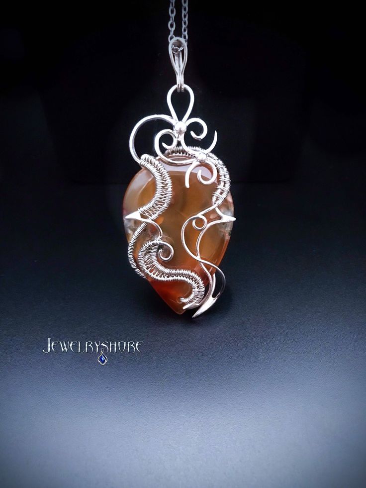 This crystal pendant wrapped in silver wire with a natural Moss Agate.                                                                                                                                                                                               It can be a unique decoration for a festive occasion or lovely gift. Gemini Birthstone, Red Moss Agate, Moss Agate Jewelry, Moss Agate Crystal, Wire Wrap Jewelry Designs, Elven Jewelry, Wire Wrap Pendant, Wire Jewelry Designs, Unique Decoration