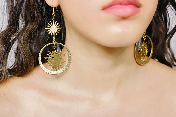 Our Soledad earrings feature a beautiful golden sun design. These earring are made of durable alloy, making them build to last and making them a perfect gift. Gold Alloy Earrings For Summer, Summer Gold Alloy Earrings, Celestial Metal Jewelry, Handmade Gold Alloy Earrings, Gold Celestial Metal Earrings, Celestial Style Gold Metal Earrings, Summer Brass Pierced Earrings, Summer Gold Brass Jewelry, Sun Design Drop Earrings For Gifts