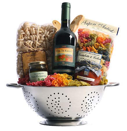 a wine bottle is sitting in a colander filled with food and condiments