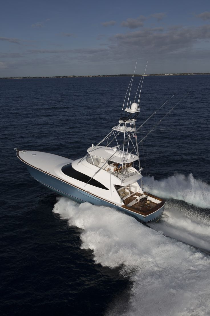 a white and blue boat is in the water