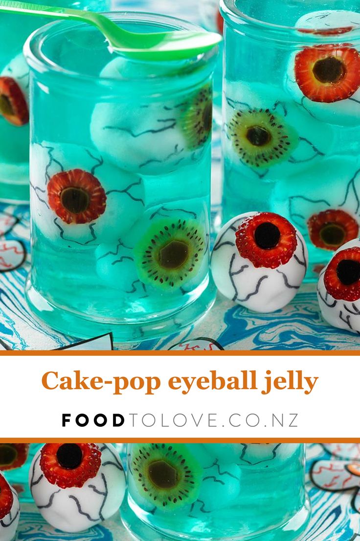 three glasses filled with blue liquid and red flowers on top of each glass is the words cake - pop eyeball jelly