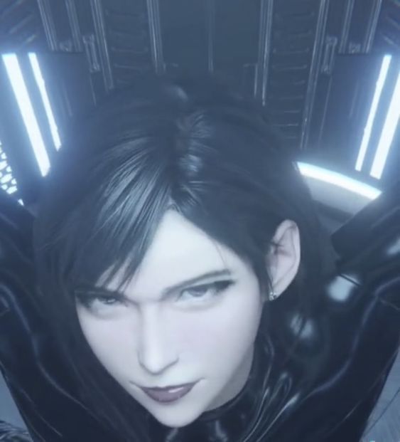 a woman with black hair and leather clothes in a futuristic space station looking at the camera