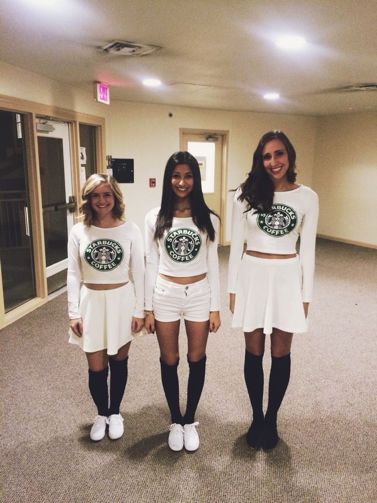 three girls in white outfits standing next to each other with starbucks shirts on their shoulders