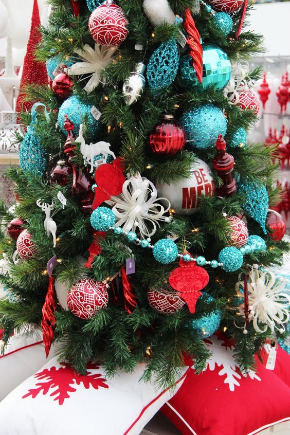 a christmas tree decorated with ornaments in red, white and blue