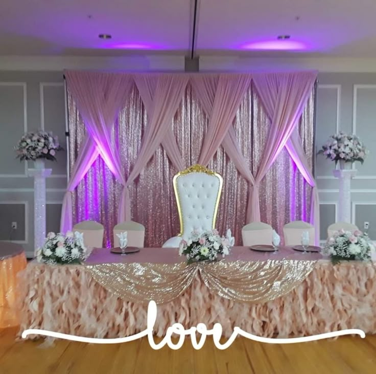 an image of a table set up for a wedding reception with love written on it