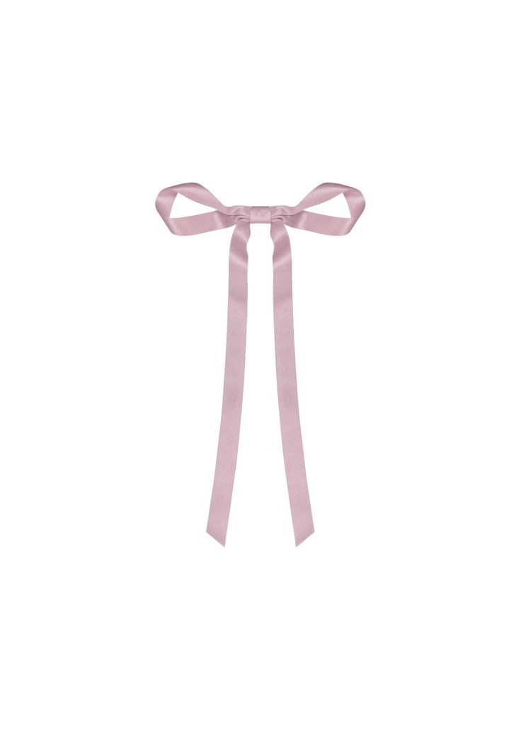 a pink ribbon tied on top of a white wall