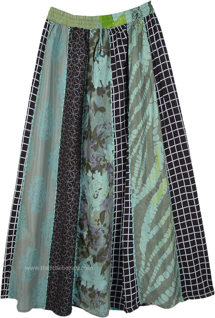 This is a vertical patchwork skirt in accordion pleats that start out smaller at the waist and get larger towards the hem - a design that is known to make you look taller.  It has an elastic waist with a drawstring to allow for flexibility and a comfortable fit. #tlb #Patchwork #MaxiSkirt #bohemianfashion #Doripatchworkskirt #HippiePatchworkSkirt #RecycledPatchworkSkirt Relaxed Patchwork Skirted Bottoms, Black Patchwork Tiered Skirt, Spring Green Patchwork Maxi Skirt, Black Tiered Patchwork Skirt, Relaxed Tiered Patchwork Skirt, Flowy Midi Skirt With Patchwork, Green Flowy Patchwork Maxi Skirt, Flowy Tiered Patchwork Skirt, Green Flowy Maxi Skirt With Patchwork