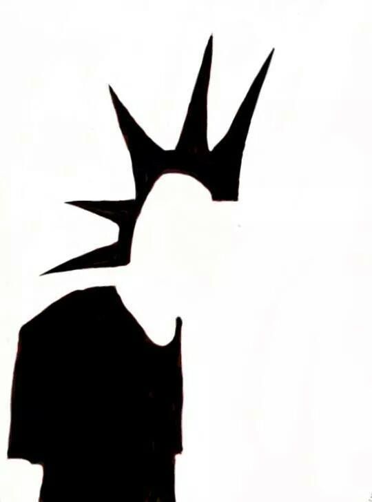 the silhouette of a person with spikes on their head