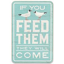 a sign that says if you feed them, they will come with seagulls