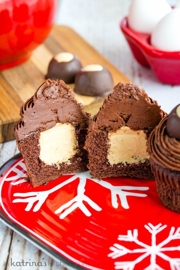 chocolate cupcakes on a red plate with snowflakes and eggs in the background