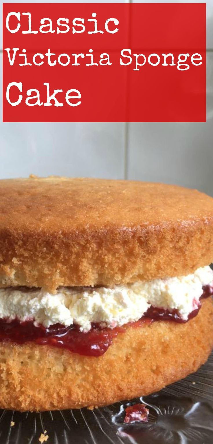 a close up of a cake on a plate with the words classic victoria sponge cake