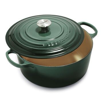 a green casserole with a brown lid