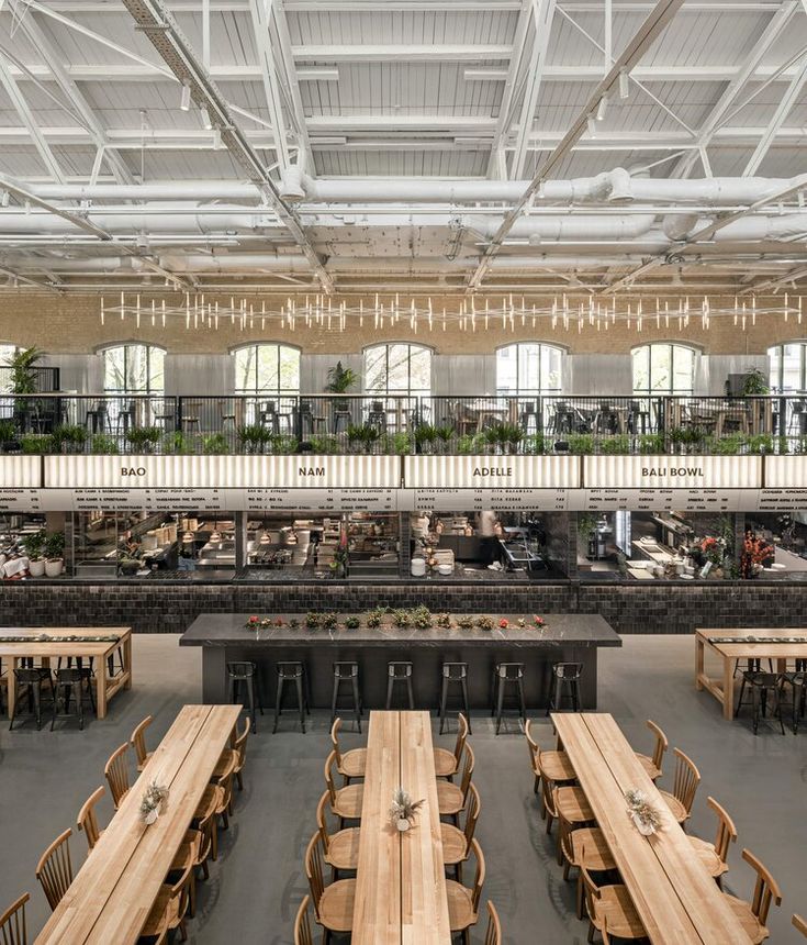 an empty restaurant with wooden tables and chairs