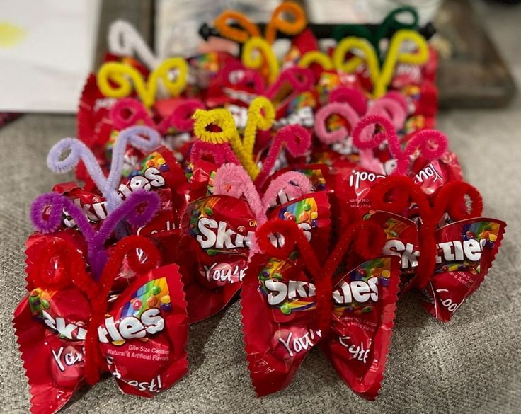 valentine's day candy hearts are arranged on a table