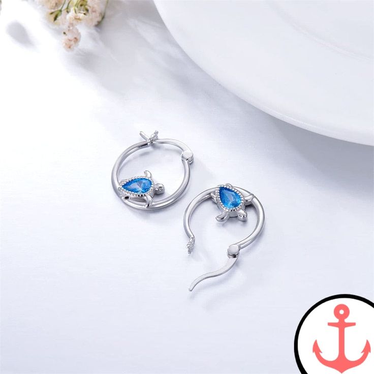 Stand Out with the Mini Sea Turtle Earrings Introducing the Mini Sea Turtle Earrings, a stunning accessory that embodies the beauty of the sea. As a passionate lover of the ocean, you deserve unique jewelry that reflects your admiration for marine life. These earrings are the perfect addition to your nautical collection, whether you're heading to the beach or simply want to showcase your love for the sea. With their silver plated finish, the Mini Sea Turtle Earrings exude a timeless elegance. Th Ocean-inspired Dangle Single Earring, Nickel-free Ocean-inspired Drop Earrings, Silver Ocean-inspired Earrings, Ocean-inspired Single Dangle Earring, Ocean-inspired Sterling Silver Dangle Earrings, Silver Ocean-inspired Earrings For Gifts, Ocean-inspired Drop Earrings For Gifts, Ocean-inspired Drop Earrings For Gift, Ocean-inspired Drop Earrings Gift