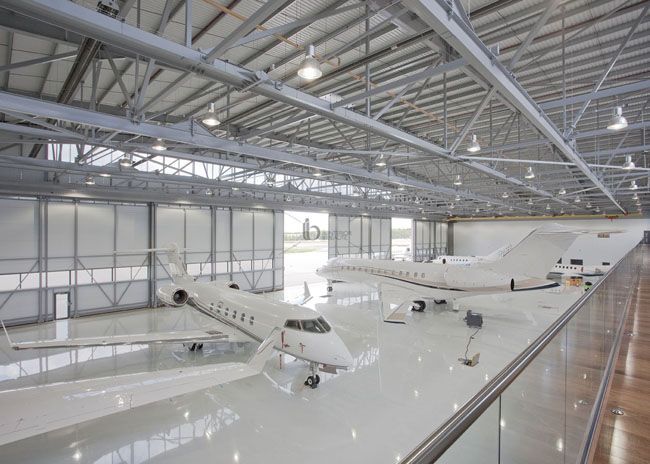 two airplanes on display in an airplane hanger