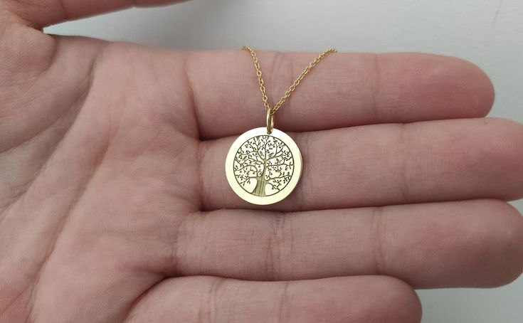 WE SHIP YOUR PARCEL IN ONE DAY! (Processing time - 1 Day, Estimated Delivery once Shipped - 3-5 business days) Engraved Family Tree Design Necklace - Tree Pendant Necklace - Handmade Tree Gold Jewelry - Engraved Tree Gold Necklace Engraved Tree of Life Pendant Necklace made out of 14K Solid Gold. Available in Yellow Gold, White Gold, or Rose Gold finish. An elegant piece of jewelry that is a perfect gift to yourself and your loved ones. Add your engraved personalization at the back of the pendan Nickel-free Gold Anniversary Necklaces, Nickel-free Gold Necklaces For Anniversary, Nickel-free Gold Necklace For Anniversary, Nickel-free Yellow Gold Jewelry For Anniversary, Yellow Gold Round Necklace With Hallmark, Dainty Round Necklace With Hallmark, 14k Gold Round Necklace With Hallmark, Nickel-free 14k Yellow Gold Charm Necklace, Everyday Gold Hallmarked Jewelry